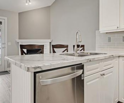503 Marshall Rise Nw, High River, AB - Indoor Photo Showing Kitchen With Double Sink