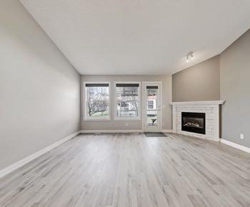 503 Marshall Rise Nw, High River, AB - Indoor Photo Showing Living Room With Fireplace