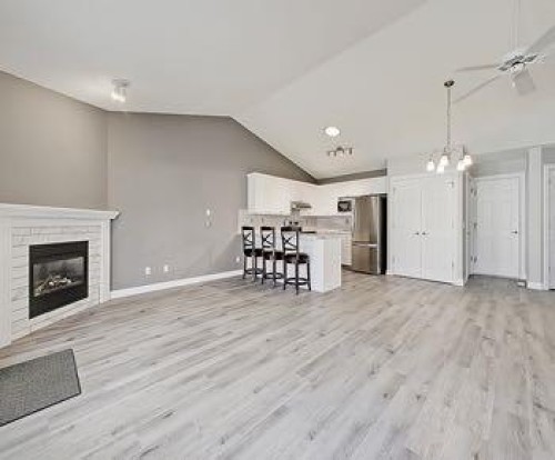 503 Marshall Rise Nw, High River, AB - Indoor Photo Showing Other Room With Fireplace