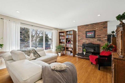 6608 Silverview Road Nw, Calgary, AB - Indoor Photo Showing Living Room With Fireplace