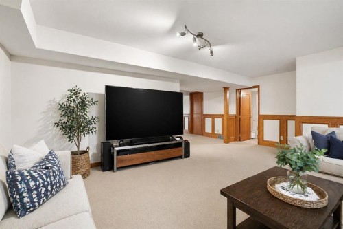 311 Coach Light Bay Sw, Calgary, AB - Indoor Photo Showing Living Room