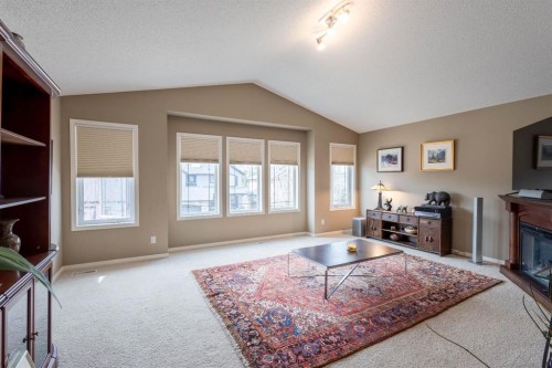 74 Valley Crest Rise Nw, Calgary, AB - Indoor Photo Showing Other Room With Fireplace