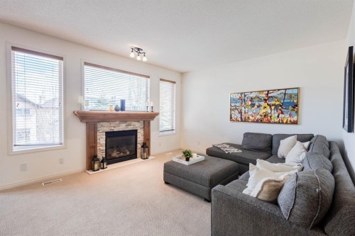 74 Valley Crest Rise Nw, Calgary, AB - Indoor Photo Showing Living Room With Fireplace