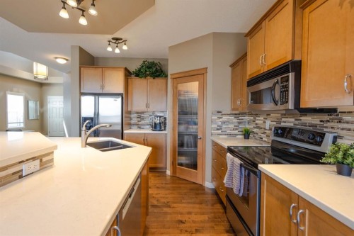 74 Valley Crest Rise Nw, Calgary, AB - Indoor Photo Showing Kitchen With Double Sink