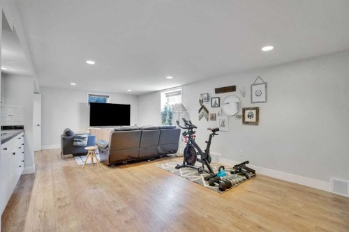 34 Malibou Road Sw, Calgary, AB - Indoor Photo Showing Gym Room