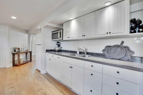 34 Malibou Road Sw, Calgary, AB - Indoor Photo Showing Kitchen With Double Sink