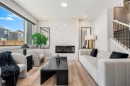 353 Seton Villas Se, Calgary, AB  - Indoor Photo Showing Living Room With Fireplace 