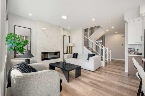 353 Seton Villas Se, Calgary, AB - Indoor Photo Showing Living Room With Fireplace