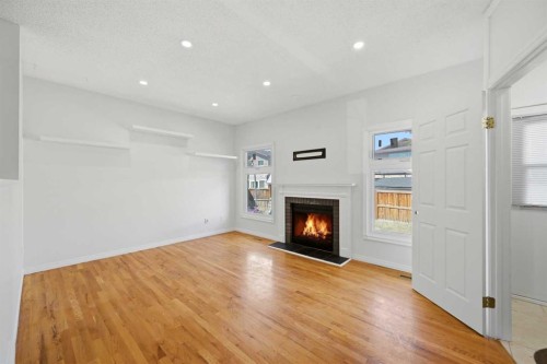 92 Whitlock Close Ne, Calgary, AB - Indoor Photo Showing Living Room With Fireplace
