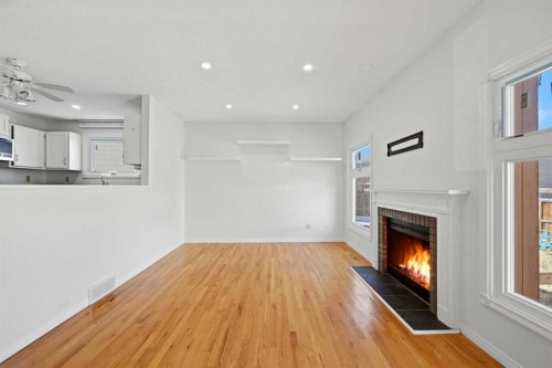 92 Whitlock Close Ne, Calgary, AB - Indoor Photo Showing Other Room With Fireplace