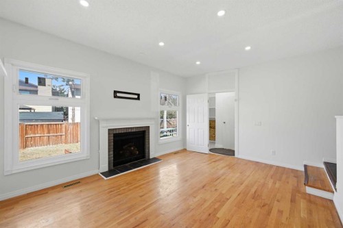 92 Whitlock Close Ne, Calgary, AB - Indoor Photo Showing Living Room With Fireplace