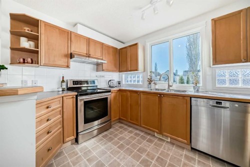 68 Tuscany Springs Way Nw, Calgary, AB - Indoor Photo Showing Kitchen With Stainless Steel Kitchen With Double Sink