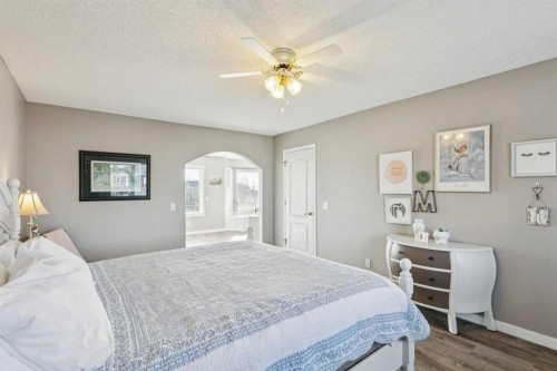 420 Rocky Ridge Bay Nw, Calgary, AB - Indoor Photo Showing Bedroom