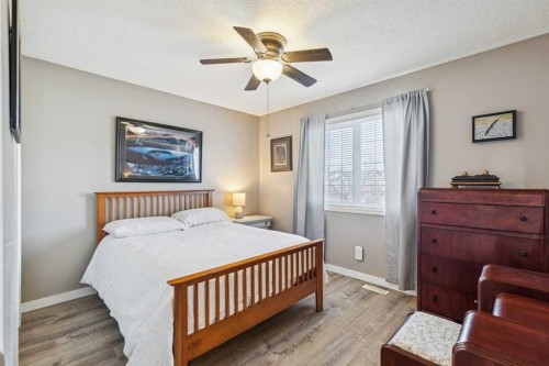420 Rocky Ridge Bay Nw, Calgary, AB - Indoor Photo Showing Bedroom