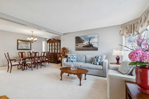 420 Rocky Ridge Bay Nw, Calgary, AB - Indoor Photo Showing Living Room