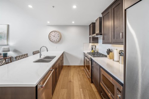 405-1408 Spring Creek Gate, Canmore, AB - Indoor Photo Showing Kitchen With Double Sink With Upgraded Kitchen