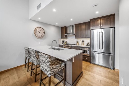 405-1408 Spring Creek Gate, Canmore, AB - Indoor Photo Showing Kitchen With Double Sink With Upgraded Kitchen