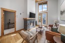 405-1408 Spring Creek Gate, Canmore, AB  - Indoor Photo Showing Living Room With Fireplace 