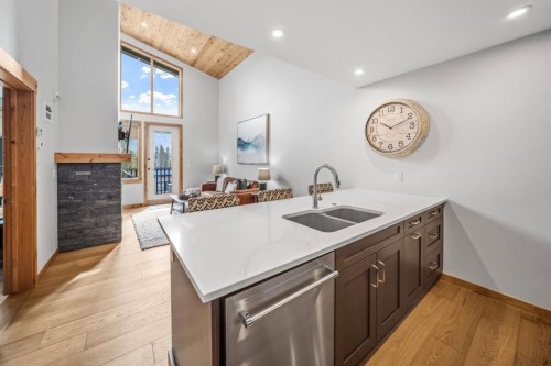 405-1408 Spring Creek Gate, Canmore, AB - Indoor Photo Showing Kitchen With Double Sink