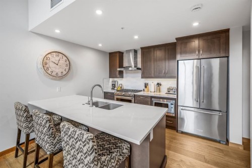 405-1408 Spring Creek Gate, Canmore, AB - Indoor Photo Showing Kitchen With Double Sink With Upgraded Kitchen