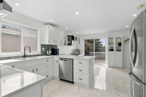 107 Cedargrove Way Sw, Calgary, AB - Indoor Photo Showing Kitchen With Double Sink