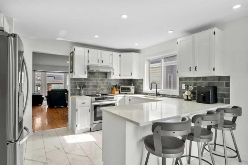 107 Cedargrove Way Sw, Calgary, AB - Indoor Photo Showing Kitchen With Upgraded Kitchen