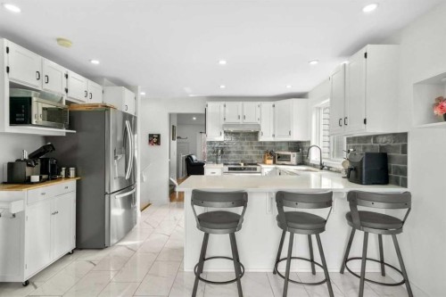 107 Cedargrove Way Sw, Calgary, AB - Indoor Photo Showing Kitchen With Upgraded Kitchen