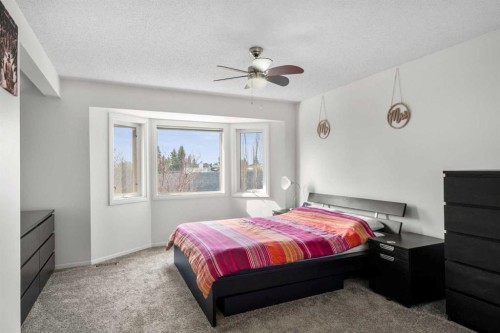 107 Cedargrove Way Sw, Calgary, AB - Indoor Photo Showing Bedroom