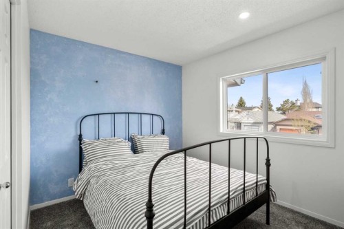107 Cedargrove Way Sw, Calgary, AB - Indoor Photo Showing Bedroom