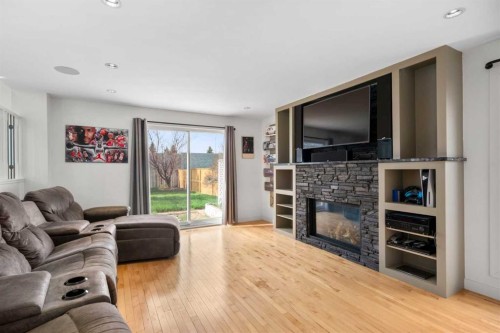 107 Cedargrove Way Sw, Calgary, AB - Indoor Photo Showing Living Room With Fireplace