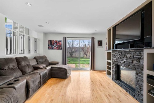107 Cedargrove Way Sw, Calgary, AB - Indoor Photo Showing Living Room With Fireplace