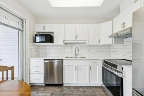 2309-2309 Hawksbrow Point Nw, Calgary, AB - Indoor Photo Showing Kitchen With Stainless Steel Kitchen With Double Sink With Upgraded Kitchen