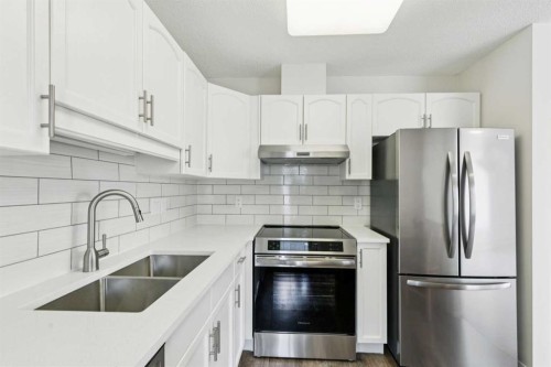 2309-2309 Hawksbrow Point Nw, Calgary, AB - Indoor Photo Showing Kitchen With Stainless Steel Kitchen With Double Sink With Upgraded Kitchen