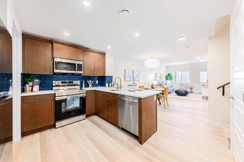 71 Ricardo Ranch Avenue Se, Calgary, AB - Indoor Photo Showing Kitchen With Double Sink
