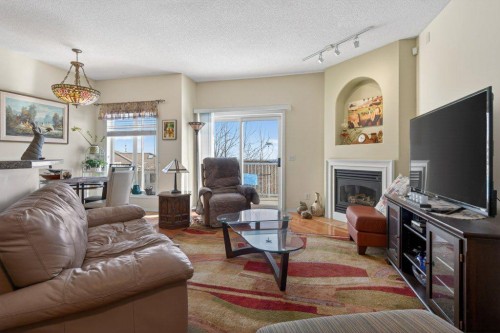 92 Hamptons Link Nw, Calgary, AB - Indoor Photo Showing Living Room With Fireplace