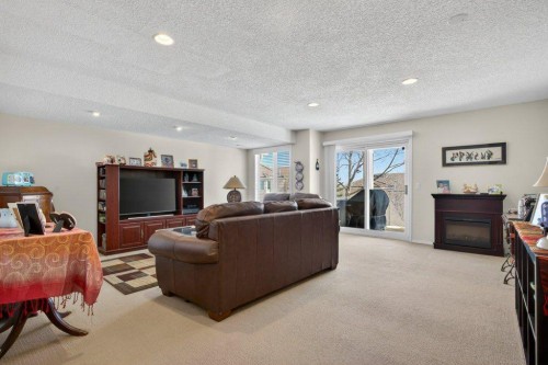 92 Hamptons Link Nw, Calgary, AB - Indoor Photo Showing Living Room With Fireplace