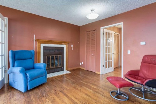 43 Mapleburn Drive Se, Calgary, AB - Indoor Photo Showing Living Room With Fireplace