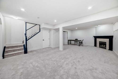 202 Hamptons Gardens Nw, Calgary, AB - Indoor With Fireplace