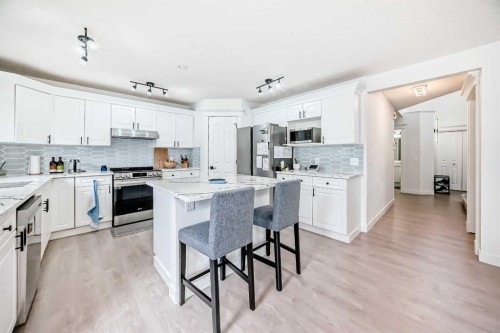 202 Hamptons Gardens Nw, Calgary, AB - Indoor Photo Showing Kitchen With Stainless Steel Kitchen
