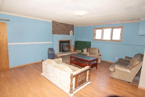 640 Mcculloch Crescent, Irricana, AB - Indoor Photo Showing Living Room With Fireplace