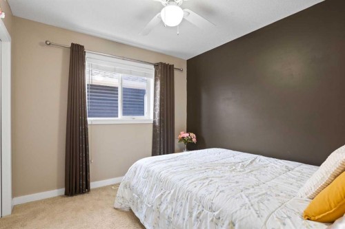 22 Brightondale Park Se, Calgary, AB - Indoor Photo Showing Bedroom