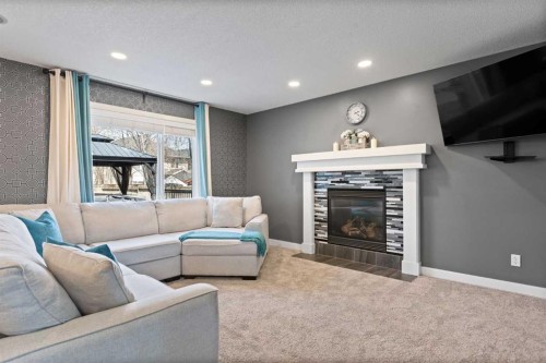 22 Brightondale Park Se, Calgary, AB - Indoor Photo Showing Living Room With Fireplace