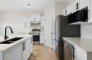 47 Covehaven Mews Ne, Calgary, AB  - Indoor Photo Showing Kitchen With Stainless Steel Kitchen With Double Sink With Upgraded Kitchen 