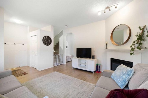 47 Covehaven Mews Ne, Calgary, AB - Indoor Photo Showing Living Room With Fireplace