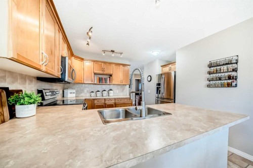 355 Ranch Ridge Court, Strathmore, AB - Indoor Photo Showing Kitchen With Double Sink