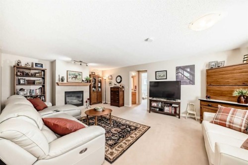 355 Ranch Ridge Court, Strathmore, AB - Indoor Photo Showing Living Room With Fireplace