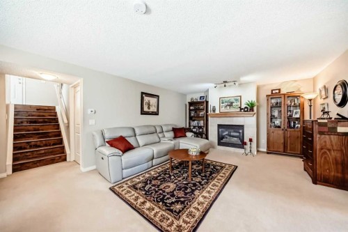 355 Ranch Ridge Court, Strathmore, AB - Indoor Photo Showing Living Room With Fireplace