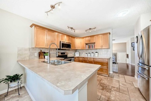 355 Ranch Ridge Court, Strathmore, AB - Indoor Photo Showing Kitchen With Double Sink