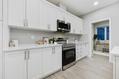 567 Osborne Drive Sw, Airdrie, AB - Indoor Photo Showing Kitchen