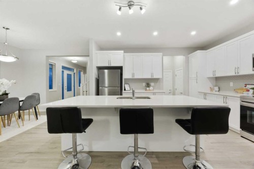 567 Osborne Drive Sw, Airdrie, AB - Indoor Photo Showing Kitchen With Upgraded Kitchen